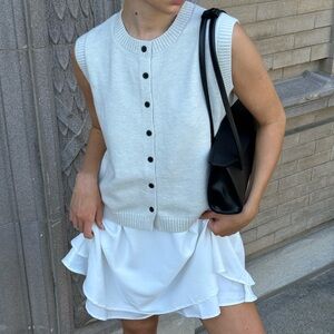 Stylish White Dress with Black Accessories